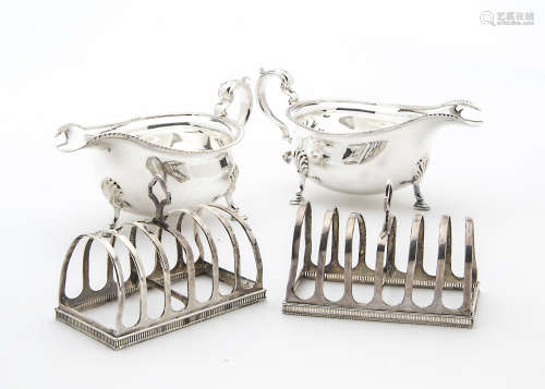 A pair of Edwardian silver toast racks