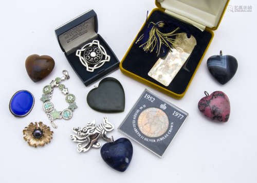 A collection of heart shaped hardstone pendants