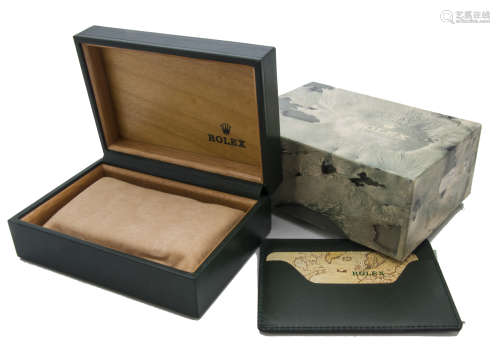 A modern Rolex box and outer box