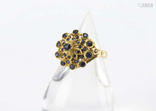 A vintage Indian gold and sapphire cluster dress ring