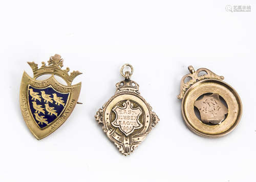 Three early 20th Century 9ct gold football medals and other items