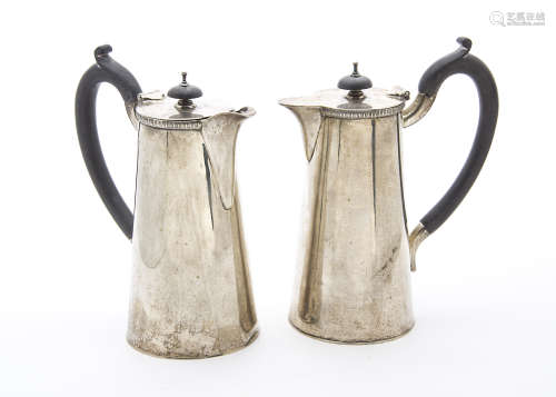 A pair of 1940s silver hot water jugs by EV