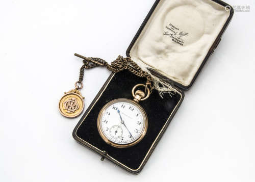 An early 20th Century gold plated pocket watch in case retailed by Harry Le Maine