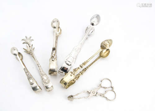 Two pairs of Victorian silver sugar tongs by HH