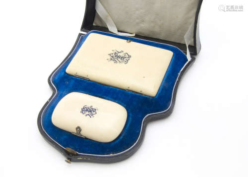 A cased Victorian ivory aide memoire and purse set
