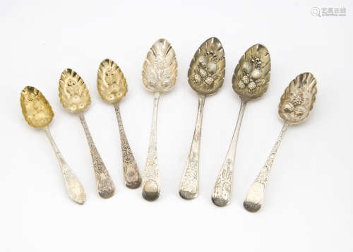 A group of seven George III and later silver berry serving spoons