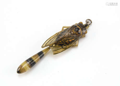 An Art Deco period carved horn insect pendant