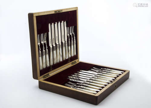 A nice late Victorian silver and mother of pearl handled dessert knife and fork set for twelve by  RFM