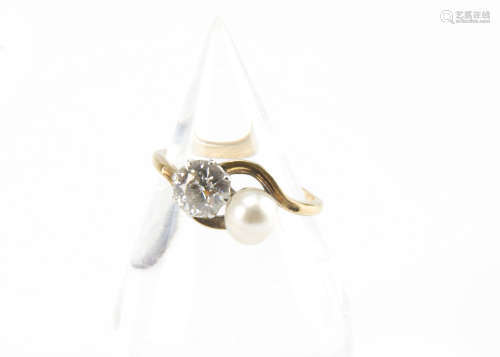 An Edwardian or later diamond and pearl crossover ring