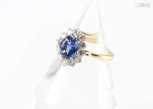 A modern 18ct gold sapphire and diamond cluster ring