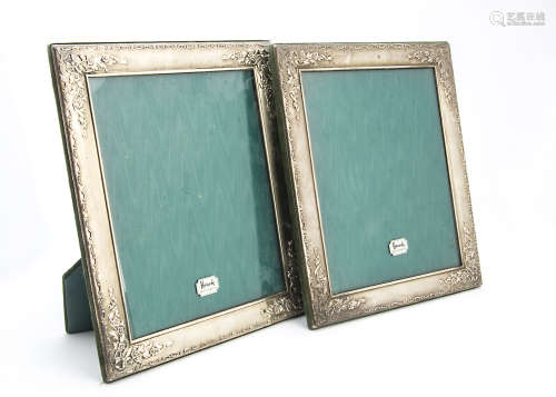 A pair of modern silver photograph frames retailed by Harrods