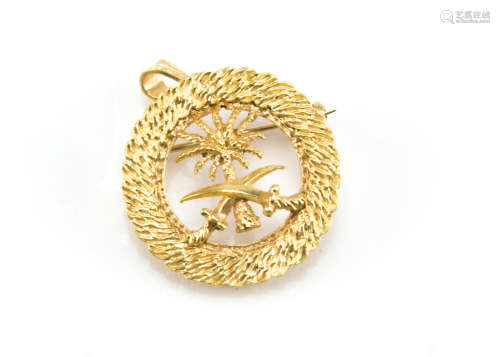 A 1980s Middle Eastern yellow metal pendant cum brooch