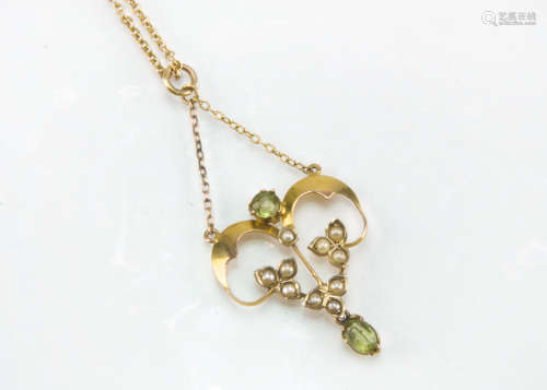 An Art Nouveau gold peridot and seed pearl pendant