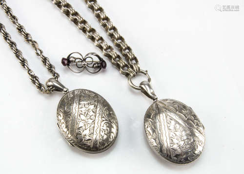 A pair of Victorian silver locket pendants