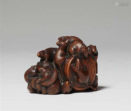 A small boxwood okimono of thirteen rats. Late 19th century