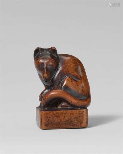 A boxwood seal netsuke of a fox. Mid-19th century