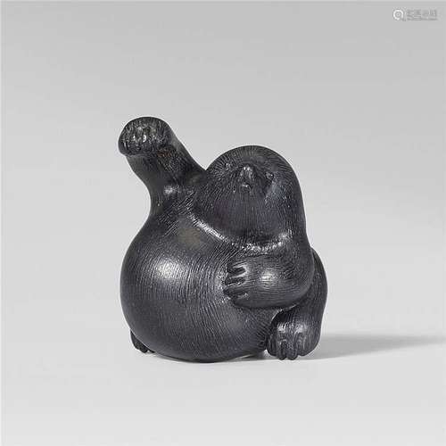 A small Tsu school ebony netsuke of a mole, by Tômin. First half 19th century