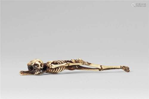 A highly unusual stag antler netsuke of a sleeping skeleton, by Sessai. Third quarter 19th century