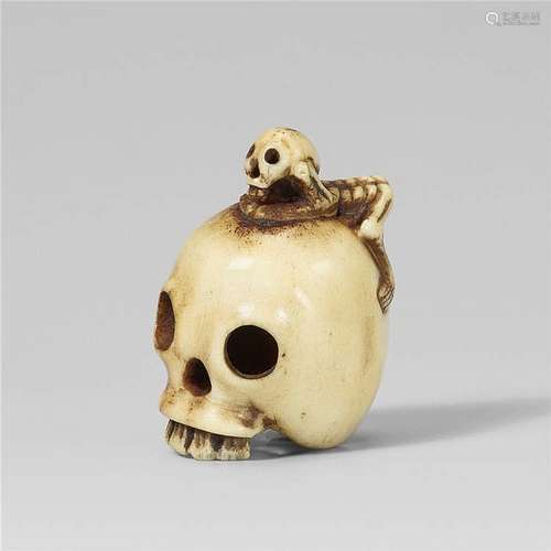 A stag antler netsuke of a skull and a skeleton. Late 19th century