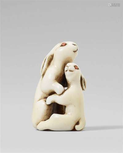 An ivory netsuke of two hares. 19th century