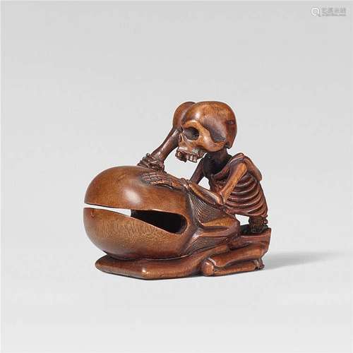 A boxwood netsuke of a skeleton beating a mokugyo. Mid-19th century