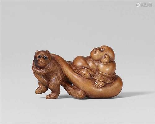 A boxwood netsuke of Hotei being pulled by a tanuki. 19th century