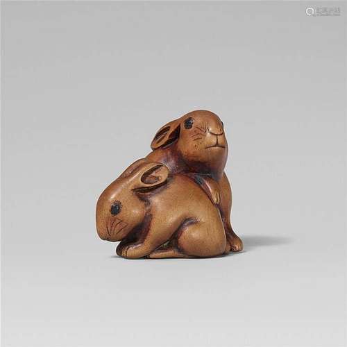 A boxwood netsuke of two hares. 19th century