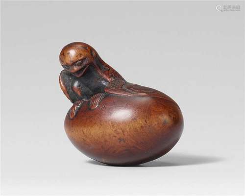 A Tanba school boxwood netsuke of a karasu tengu hatching from an egg, by Toyoyasu. Mid-19th century