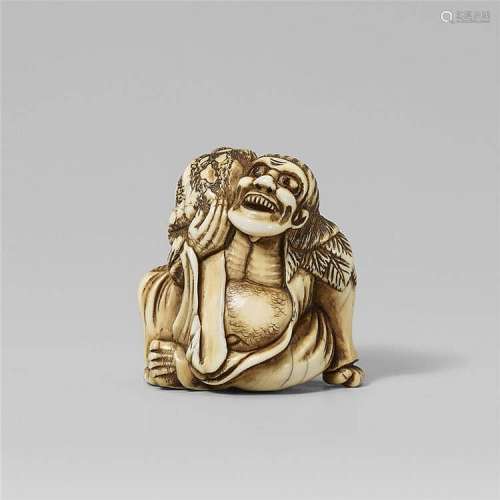 An ivory netsuke of a laughing Gama Sennin with a toad. Late 18th century