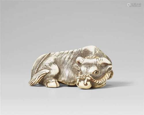 A large ivory netsuke of a recumbent ox. Late 18th/early 19th century