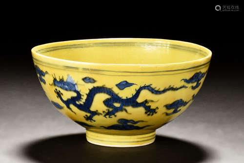 A RARE YELLOW-GROUND UNDERGLAZE BLUE 'DRAGON' BOWL