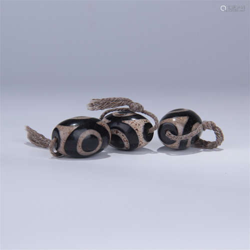 THREE TIBETAN DZI BEADS