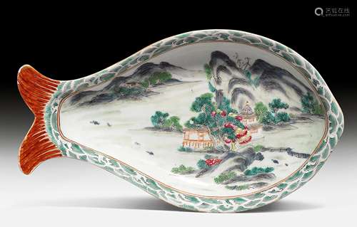 A CARP-SHAPED PLATE PAINTED WITH A LANDSCAPE IN POLYCHROME ENAMELS.