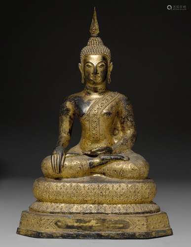 A LACQUER-GILT BUDDHA SEATED ON A LOTUS THRONE.