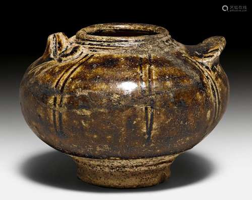 A GLAZED CERAMIC POT WITH RELIEF DESIGN OF A BIRD.