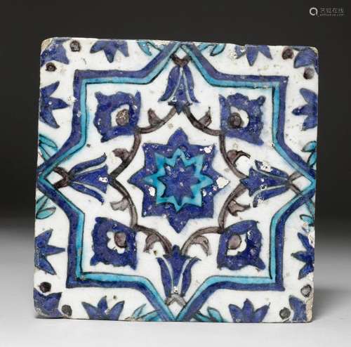 A TILE OF QUARTZ FRITWARE IN COBALT, TURQUOISE AND MANGANESE.