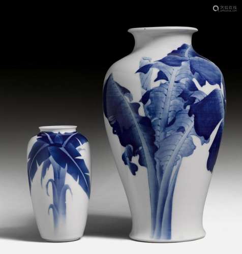 TWO BLUE AND WHITE VASES PAINTED WITH BANANA PLANTS.