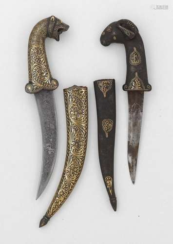 TWO GOLD-DAMASCENED DAGGERS WITH ZOOMORPHIC GRIPS.