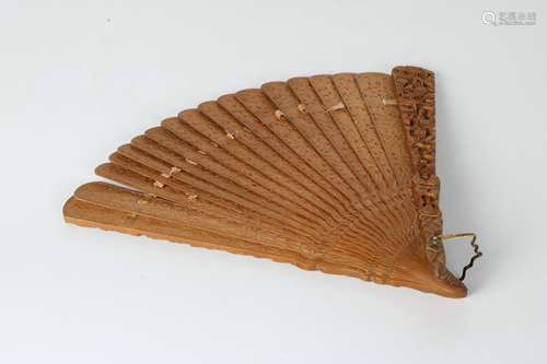 A Carved Sandalwood Fan.