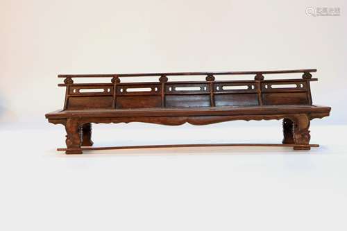 A Huanghuali Row Chair.