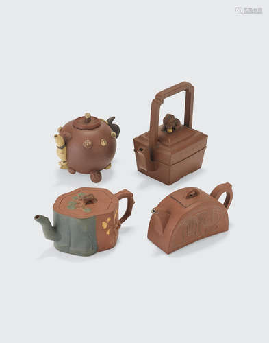 a group of Four Yixing pottery teapots