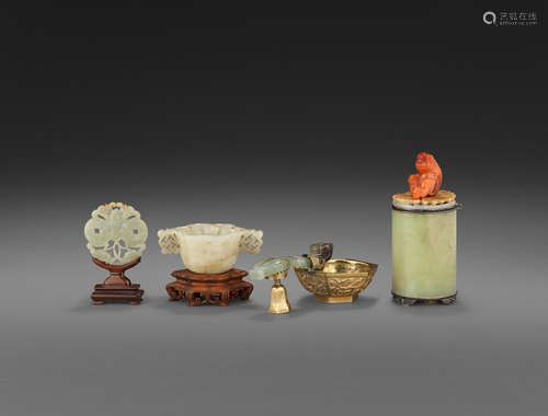 a group of Four jade and hardstone decorations