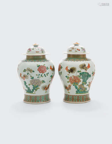 A pair of famille rose enameled jars and covers