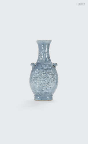 Qianlong mark, Late Qing/Republic period A sky-blue glazed vase with molded dragon decoration