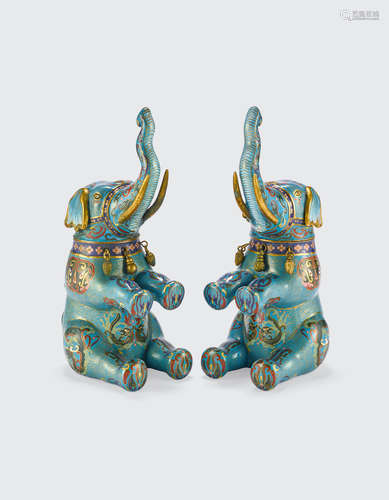 20th century A pair of cloisonné enameled seated elephants