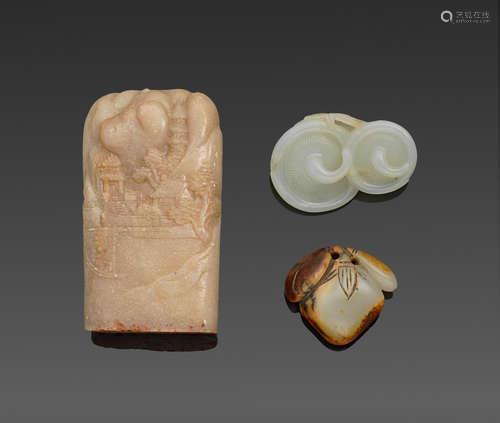 a group of Three jade and soapstone carvings