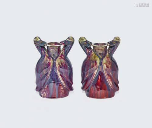 A pair of transmutation red glazed duck vases