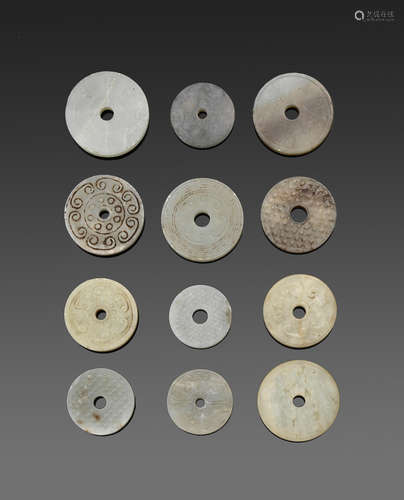 a group of Twelve jade and hardstone bi disks