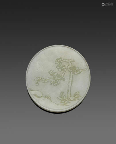 A carved circular jade plaque