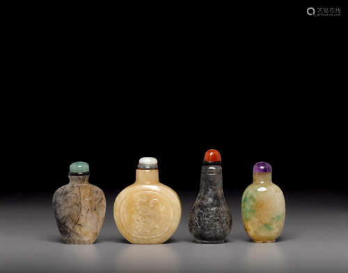 a group of Four jade and hardstone snuff bottles